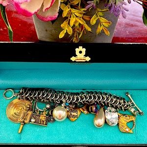 One of a kind JC bracelet with 13 charms all beautiful & chic